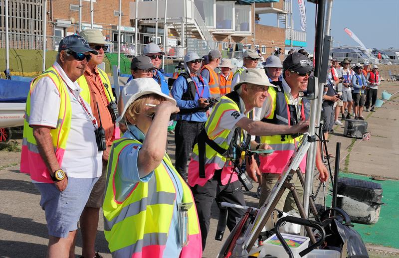2026 IOM Worlds at Datchet Water Day 5 - The start line team with skippers in the background - photo © Mark Jardine