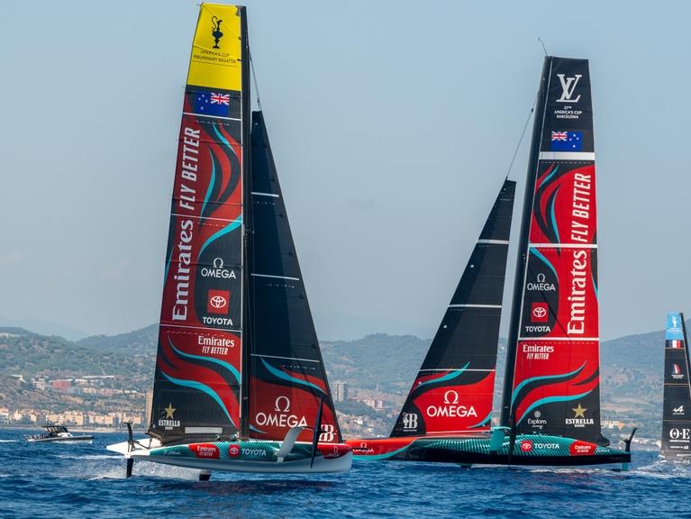 Emirates Team New Zealand AC 40, passes to windward of the AC75 in Barcelona photo copyright James Somerset / Emirates Team New Zealand taken at Royal New Zealand Yacht Squadron and featuring the AC40 class