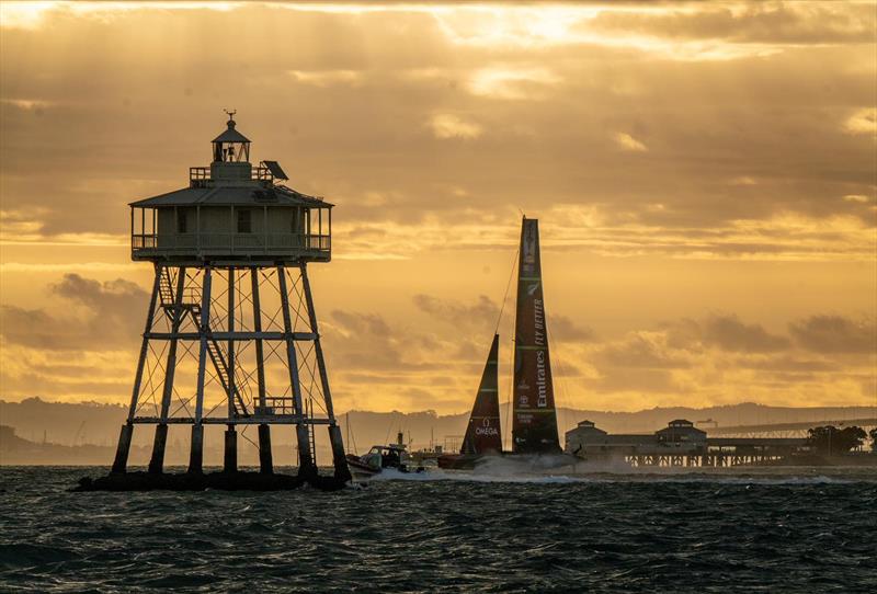 A late return home - Emirates Team NZ passes the iconic Bean Rock - photo © Emirates Team New Zealand