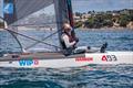 © Gordon Upton / www.guppypix.com Stevie Brewin keeps off the hot Kiwi sun .- Day 5 Predictwind A-Class Catamaran World Championships - Milford, NZ - November 16, 2025 © Gordon Upton / www.guppypix.com