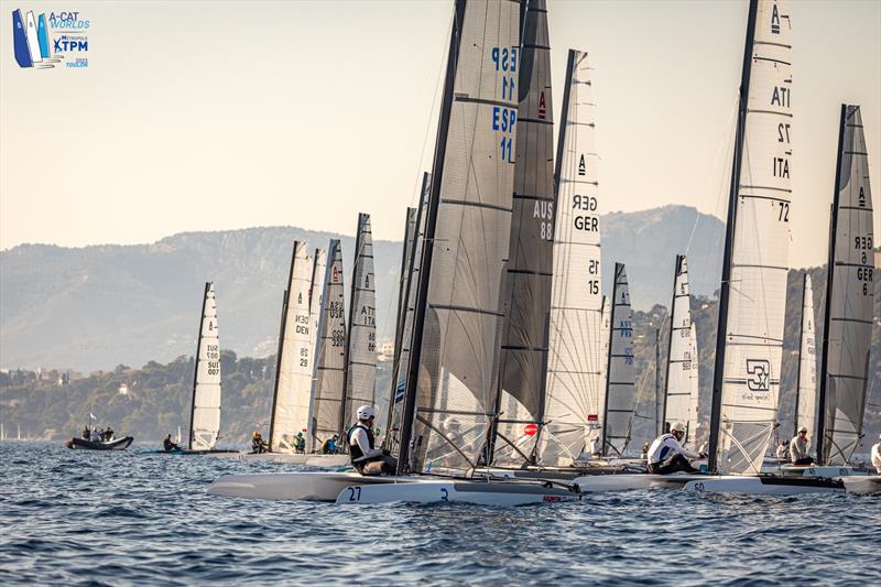 A-Cat Worlds at Toulon, France Day 1 - The start of the Open foiling fleet. Note they are not foiling. Minimum conditions led to the race being canned at the top mark photo copyright Gordon Upton / www.guppypix.com taken at Yacht Club de Toulon and featuring the A Class Catamaran class