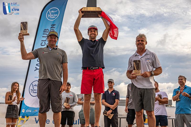 A-Cat Worlds at Toulon, France Day 6 - The Open Fleet Podium: Kuba Surowiec POL, Misha Heemskerk NED, Darren Bundock AUS photo copyright Gordon Upton / www.guppypix.com taken at Yacht Club de Toulon and featuring the A Class Catamaran class