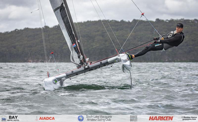 Australian A-Cat Nationals on Lake Macquarie Day 2 - Matt Johnson heads upwind in the Classic fleet - photo © Gordon Upton