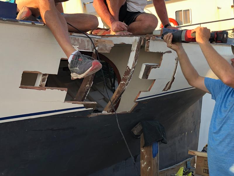 Damage being repaired on Tari Anne by crews from both colliding sloops photo copyright Exuma Sailing Club taken at  and featuring the Bahamian Sloop class