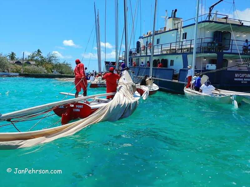 Regatta over, sloops are loaded onto inter island barges by crane for transport to home ports photo copyright Jan Pehrson taken at  and featuring the Bahamian Sloop class