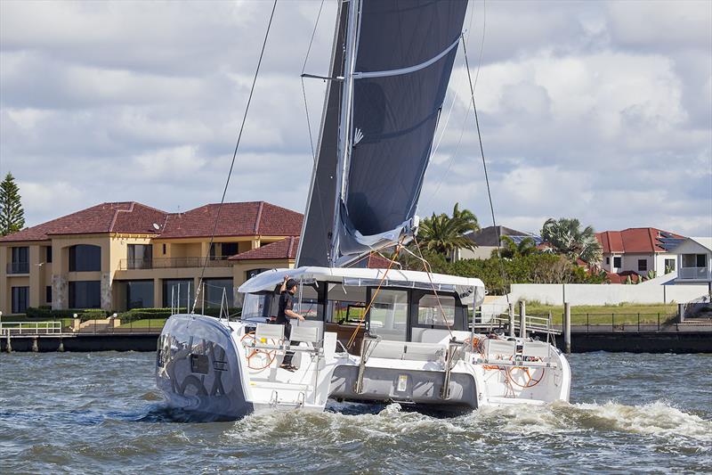 Micah Lane demonstrates the 'run' from helm to helm. Excess 11 photo copyright John Curnow taken at  and featuring the Catamaran class
