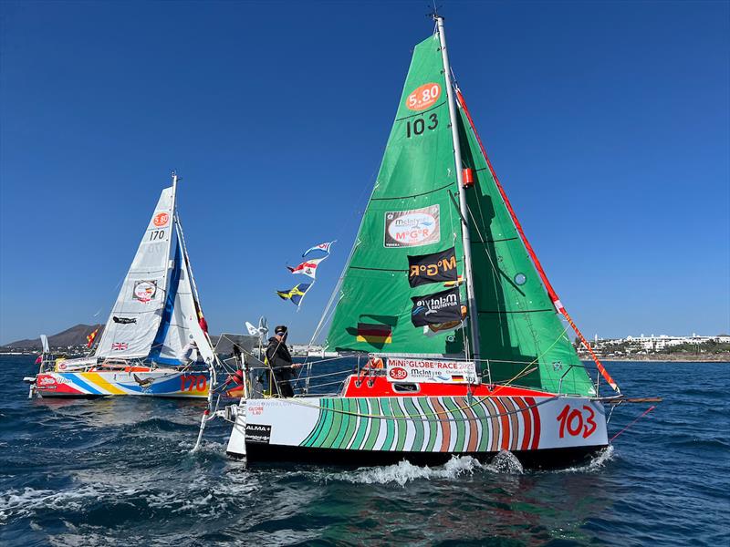 McIntyre Globe 580 Transat: Colourful paint jobs distinguish the ALMA Globe 580 one-design yachts. Christian Sauer (44, Germany) in the Xmas Tree Boat “ARGO” and professional sailing instructor Adam Waugh (UK) sailing “Little Wren” are two of the best photo copyright Rob Havill / G580Transat / MGR2025 taken at  and featuring the Class Mini 5.80 class