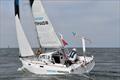 In March, 2022, Kenichi Horie set sail under the Golden Gate Bridge aboard Suntory Mermaid III, an 18-foot sloop, reversing the Japan to San Francisco voyage he made 60 years earlier  © Latitude 38