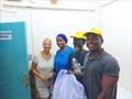 Accepting the meds from the clinic was Eliza King, along with Sey Samba, the OCC port captain in Gambia and Mohammed Keata, OCC member and check-in agent here in Banjul. Lori Muller on the left