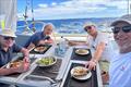 Pegasus 50 Sine Finis crew enjoying a meal