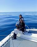 Kim and daughter Sophia,watching dolphins, counting sharks & crabs during 220 nautical miles, crossing of the Bay of Biscay, France © Kim Lawler