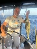 Captain Amir Mersik with their first fish on Relax