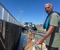 At the top in a lock with a barge