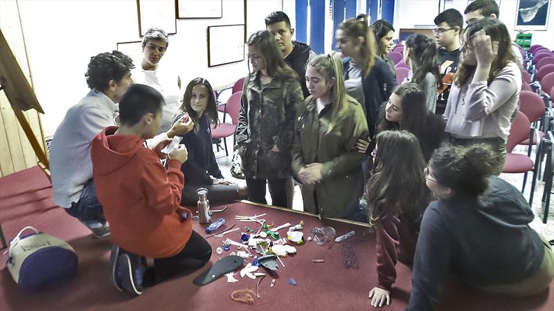 Looking at plastic pollution samples with 13-year olds photo copyright Mission Ocean taken at  and featuring the Cruising Yacht class