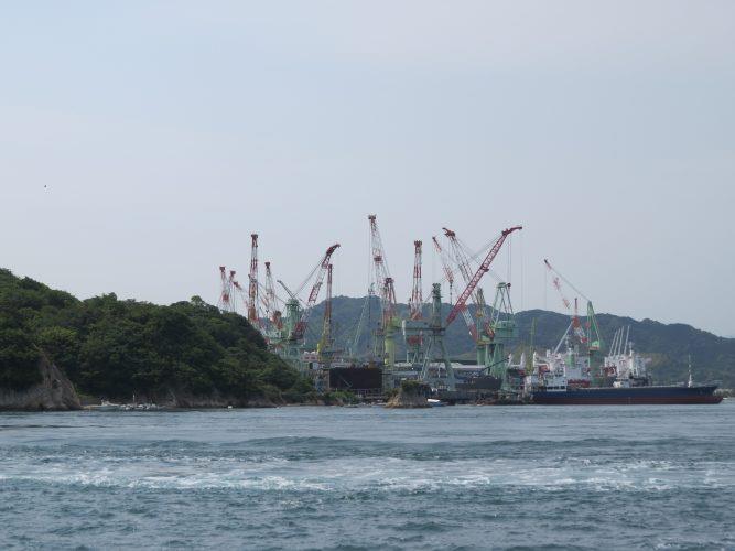 Island landscape with one of the big shipbuilding facilities. - photo © Stephen and Nancy Carlman