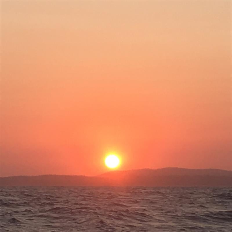 Who could ever tire of these sunsets at sea? Enjoying a stunning evening before our first pitch black bar crossing - photo © Kristen Anderson