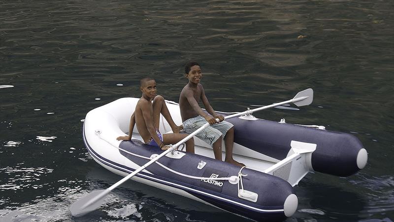Local kids having fun in our Plastimo tender - easier to row than a wooden fishing boat! - photo © Mission Océan