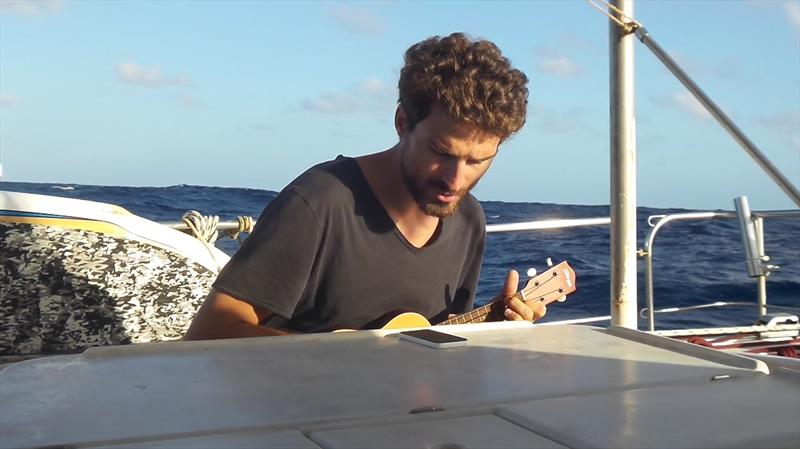 Jeremie and his ukelele on deck photo copyright Mission Ocean taken at  and featuring the Cruising Yacht class