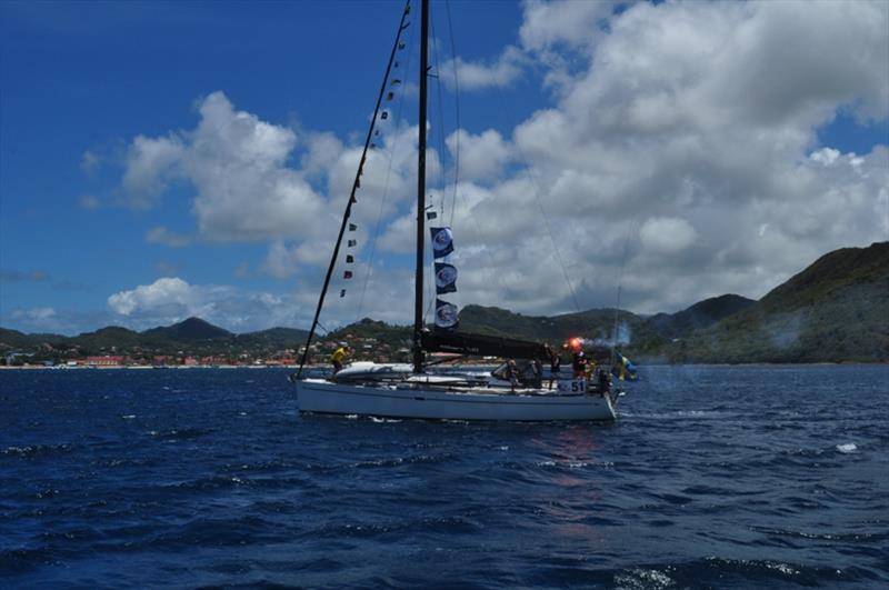 Swedish family boat Take Off cross the line - photo © World Cruising Club