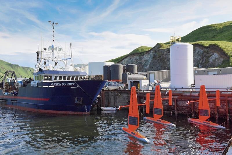 Three saildrones are docked next to a larger ship and ready to launch photo copyright Saildrone Inc. via NOAA PMEL taken at  and featuring the Cruising Yacht class