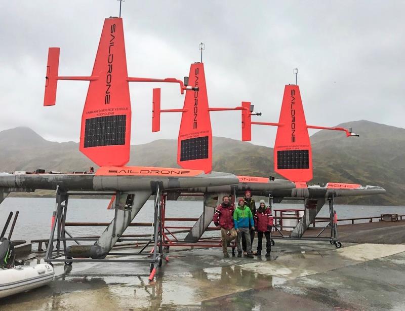 The saildrone recovery crew in front of three saildrones in Dutch Harbor, AK - photo © Saildrone Inc. via NOAA PMEL