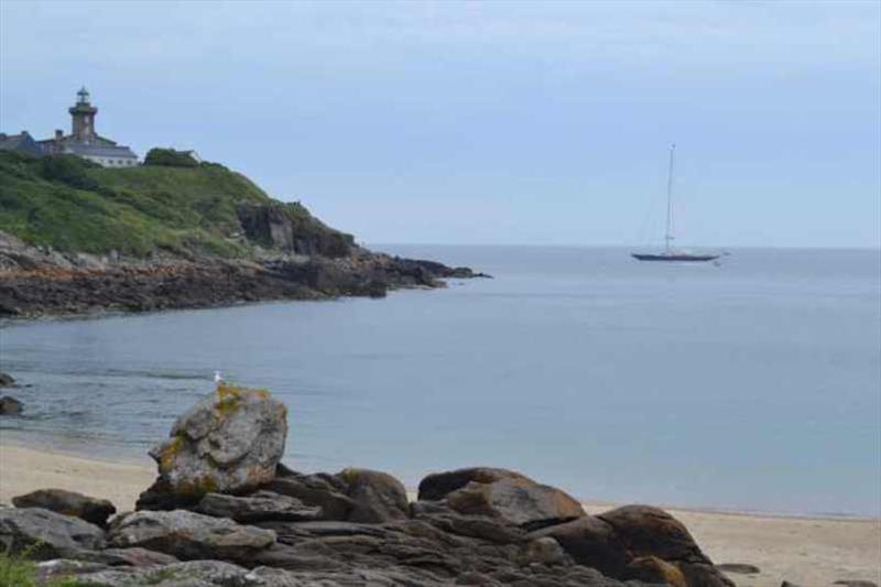 A massive yacht anchored off the island photo copyright Red Roo taken at  and featuring the Cruising Yacht class