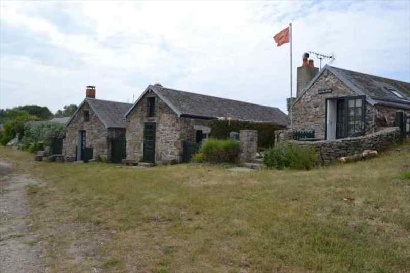 Island houses/huts photo copyright Red Roo taken at  and featuring the Cruising Yacht class