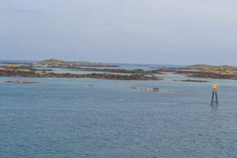 Exposing rocks and sandy beach coves as the water level drops with the tide photo copyright Red Roo taken at  and featuring the Cruising Yacht class