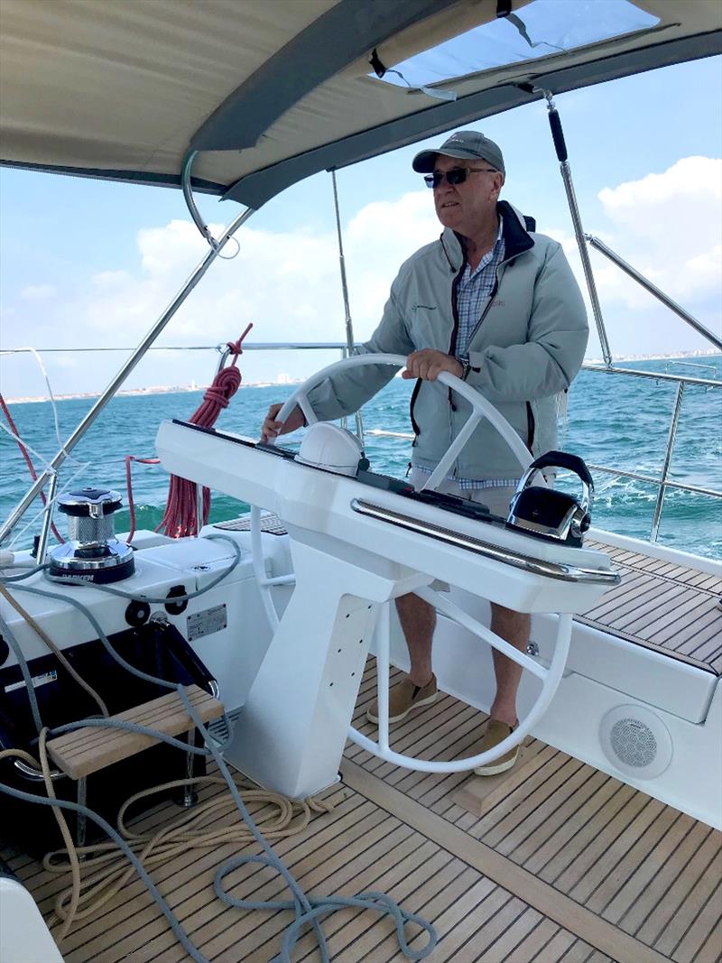 Ian Douglas from Mooloolaba Yacht Brokers looking comfortable behind the wheel photo copyright Mooloolaba Yacht Brokers taken at  and featuring the Cruising Yacht class