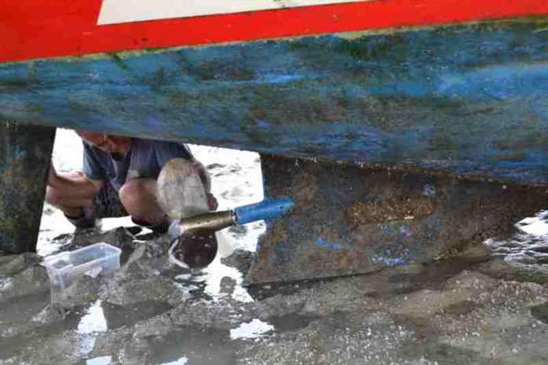 Let the cleaning & scraping begin, Phil working on the propeller photo copyright SV Red Roo taken at  and featuring the Cruising Yacht class