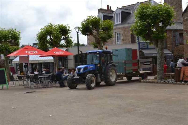 Tractors delivering stores from the ferry to the town photo copyright SV Red Roo taken at  and featuring the Cruising Yacht class