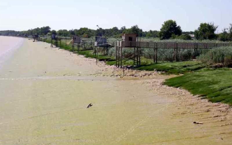 Fishing Shacks on the La Garonne River photo copyright SV Red Roo taken at  and featuring the Cruising Yacht class