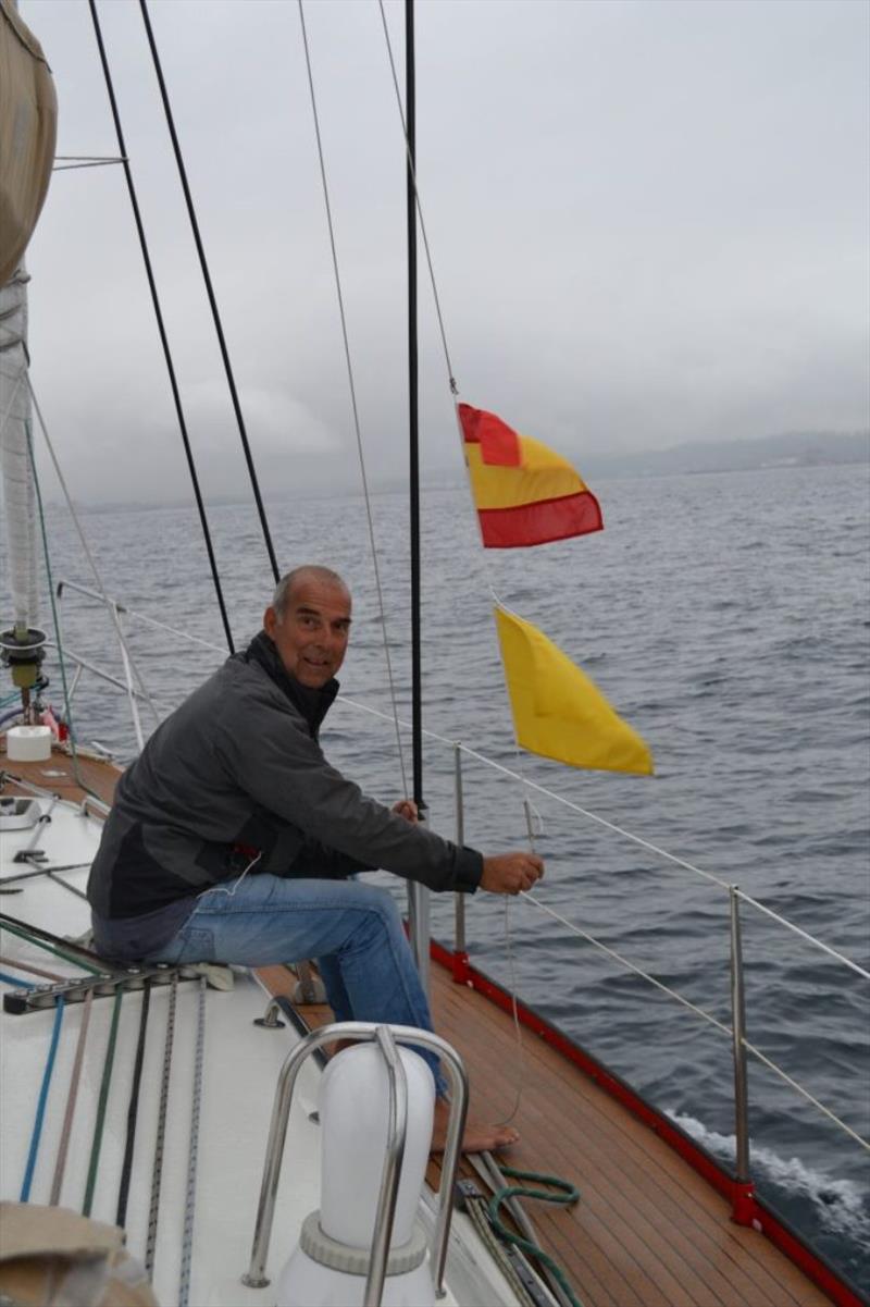 In the calmness of the bay of Gijón we finally raise the Spanish flag - photo © SV Red Roo