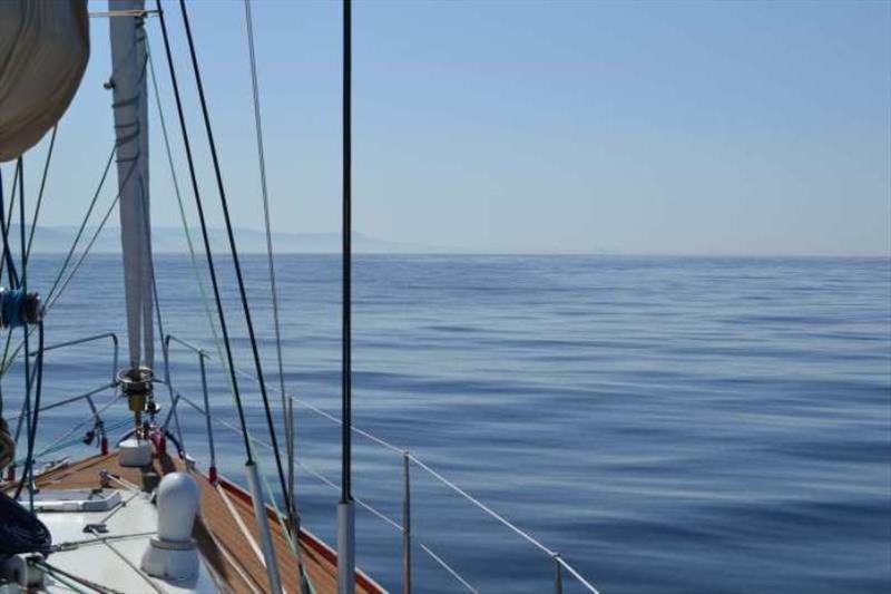 Contrast to earlier passages, a flat calm sea = motoring photo copyright SV Red Roo taken at  and featuring the Cruising Yacht class