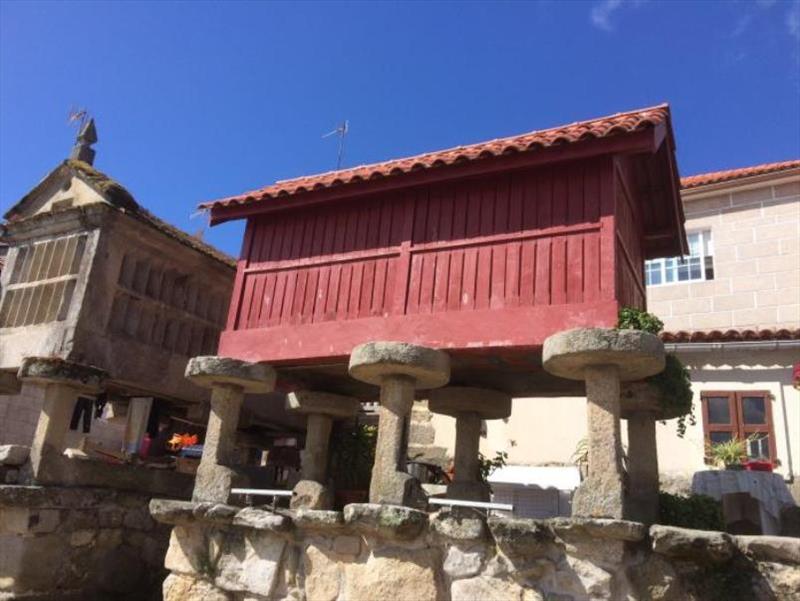 Wooden hórreos, notice the legs to keep them high and dry as well as the vermin proof stones at top of legs - photo © SV Red Roo