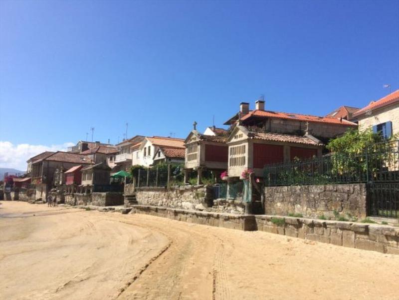 The shore at Combarro with hórreos (store houses) photo copyright SV Red Roo taken at  and featuring the Cruising Yacht class