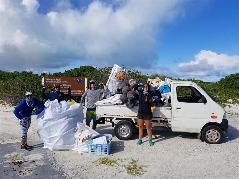 We collect and clear away a truckload of debris from Sand Island on Midway Atoll - photo © NOAA Fisheries