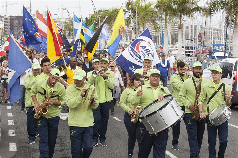 La Charanga de la Aldea lead crew from 30 nations around the marina at the official ARC Opening Ceremony in Las Palmas de Gran Canaria photo copyright Clare Pengelly taken at  and featuring the Cruising Yacht class