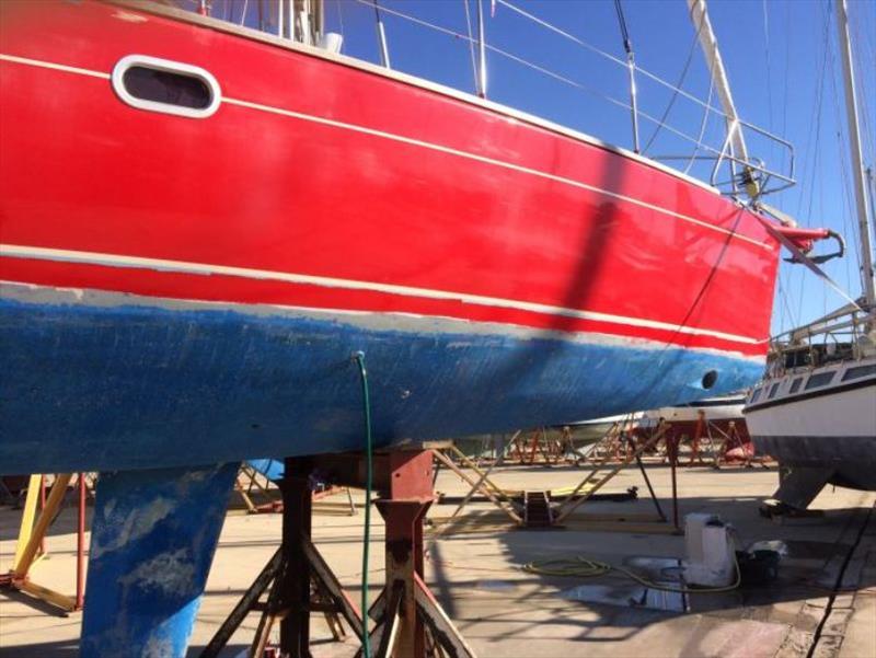 New waterline red – Masking tape still on photo copyright SV Red Roo taken at  and featuring the Cruising Yacht class