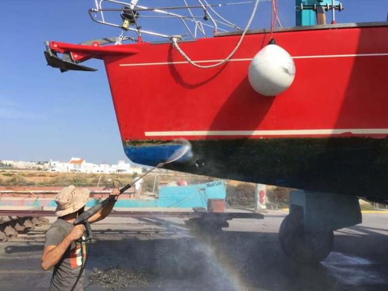 High pressure wash to clean the growth off the hull - photo © SV Red Roo