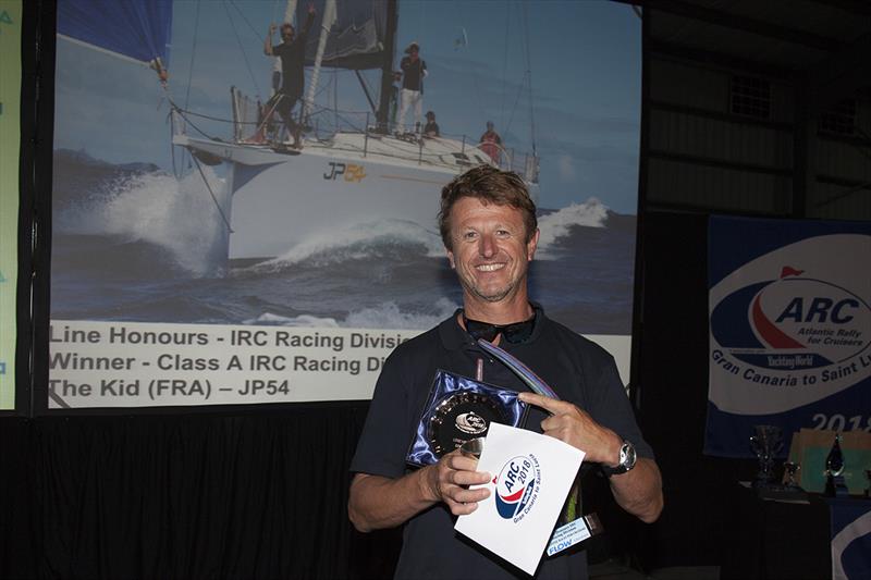 2018 ARC - Prize-giving - Line Honours for the Racing Division and winner of Class A at the Prizegiving Ceremony was French sailing legend JP Dick and his crew from The Kid photo copyright Clare Pengelly taken at  and featuring the Cruising Yacht class