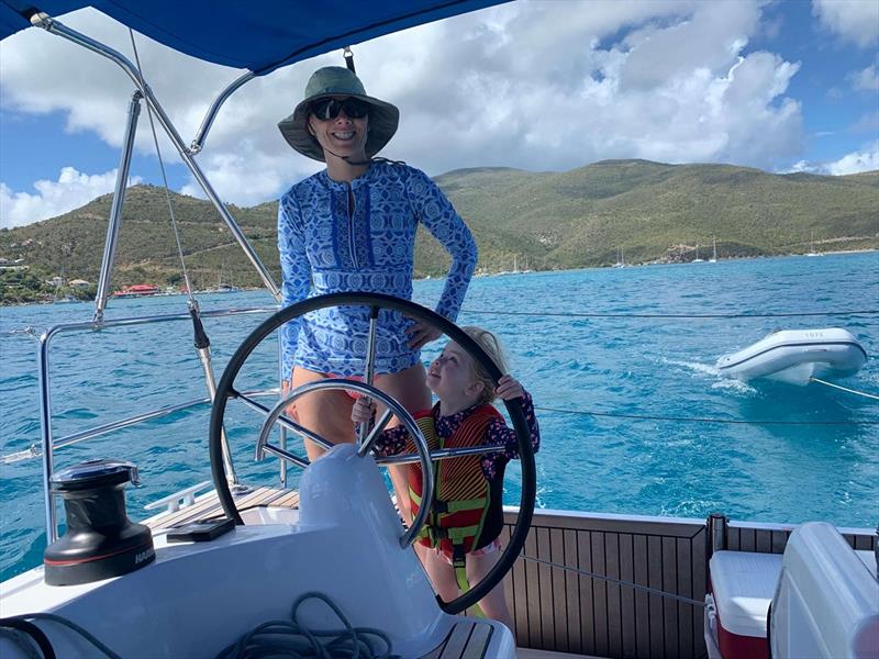 Emilie wanted to take the helm while headed to Leverick Bay. - photo © Catherine Guiader