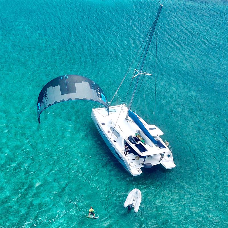 Kiteboarding whilst at anchor photo copyright Sailing Wildside taken at  and featuring the Cruising Yacht class