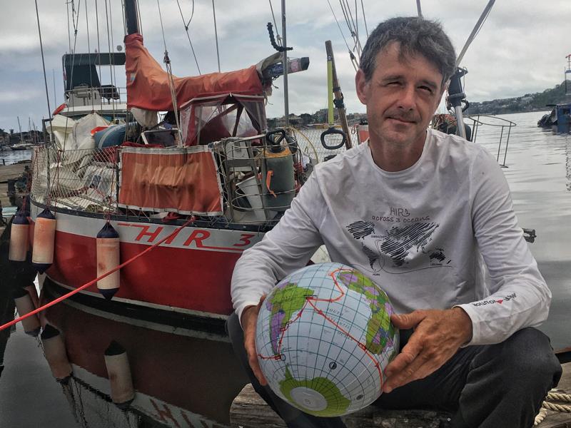 Saša in front of HIR3 in Salvador after completing the circumnavigation photo copyright Ocean Cruising Club taken at  and featuring the Cruising Yacht class