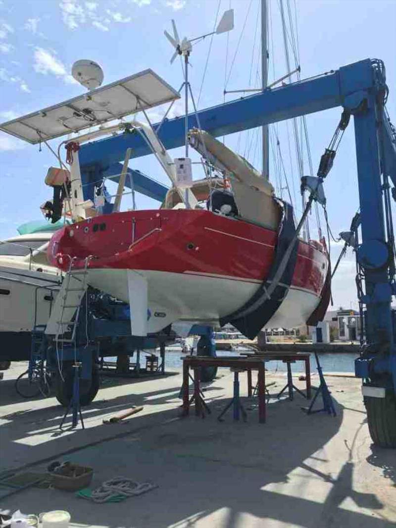 Back on the travel lift, painting the bits previously hidden by the support stands before going back in the water photo copyright Red Roo taken at  and featuring the Cruising Yacht class