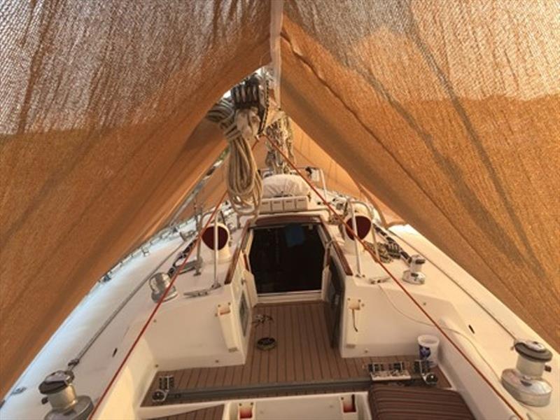 View under the sun shade awning as we start to ‘gift wrap' the rig with aluminum foil photo copyright Rob Murray taken at  and featuring the Cruising Yacht class