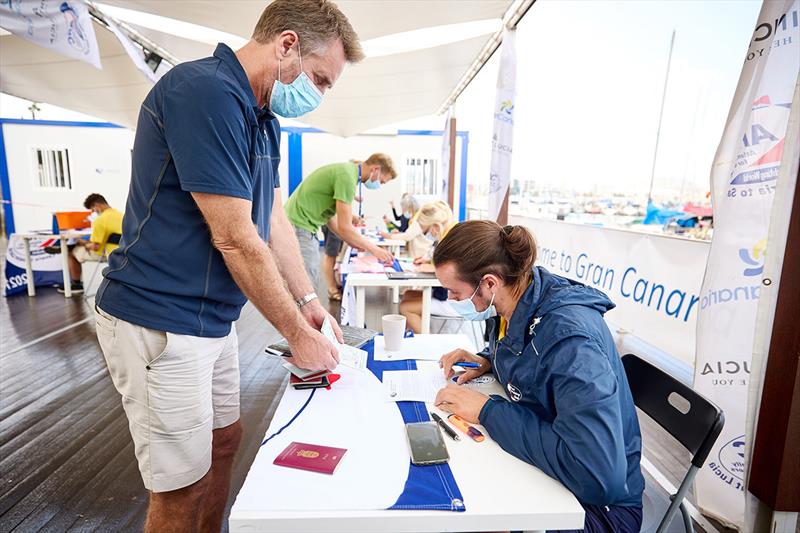 2021 ARC - Checking out from Las Palmas de Gran Canaria with passports of every crew on board photo copyright James Mitchell taken at  and featuring the Cruising Yacht class