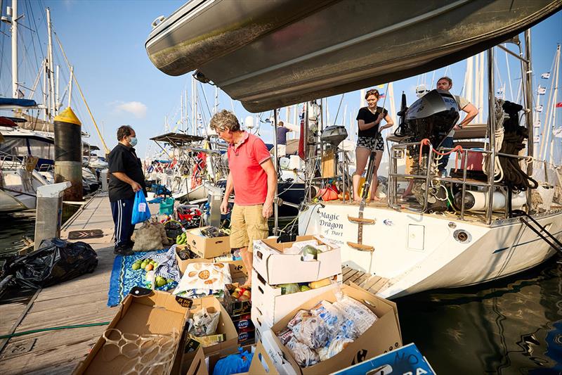 2021 ARC - Magic Dragon of Dark loading all the provisions for the ARC crossing photo copyright James Mitchell taken at  and featuring the Cruising Yacht class