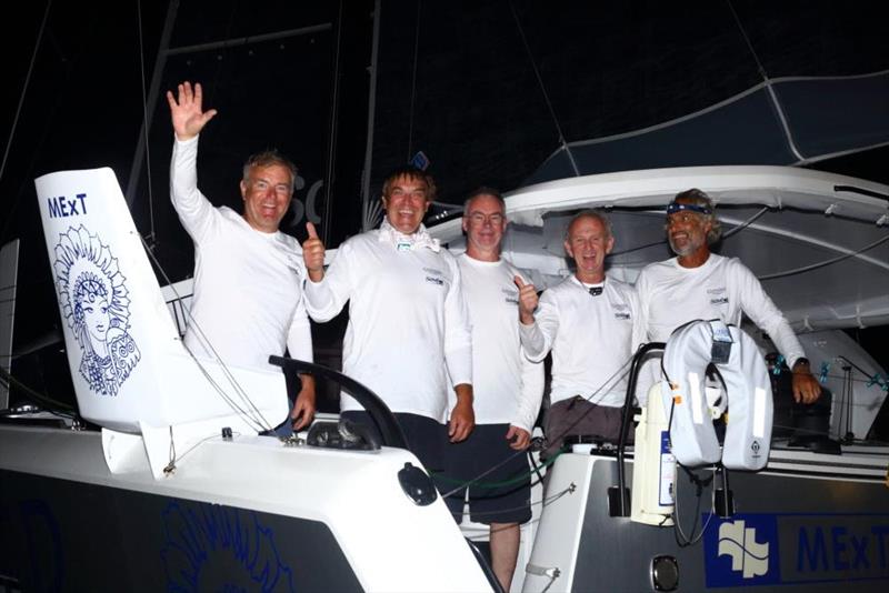 Guyader Saveol crew celebrating their arrival after a closely fought match race with 12 Nacira 69 - 2021 ARC photo copyright WCC / Tim Wright taken at  and featuring the Cruising Yacht class