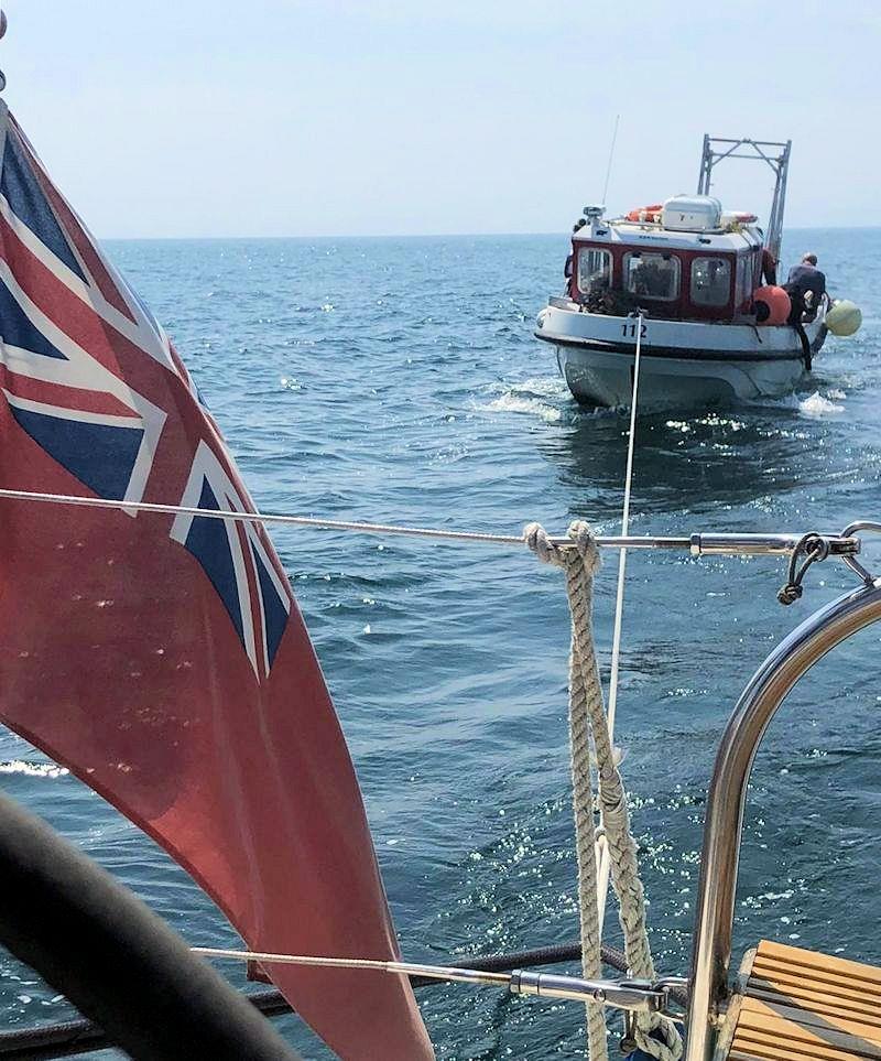 Phoenix YC's Quartette takes a dive boat on a tow after a Pan-Pan call photo copyright PYC taken at Phoenix Yacht Club and featuring the Cruising Yacht class